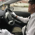 Taxi driver in Hiroshima with white gloves and hat